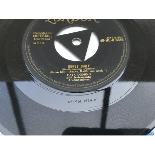 300 - Two collectable 7inch singles comprising 'Hound Dog/Don't Be Cruel' on purple and gold HMV labels to... 