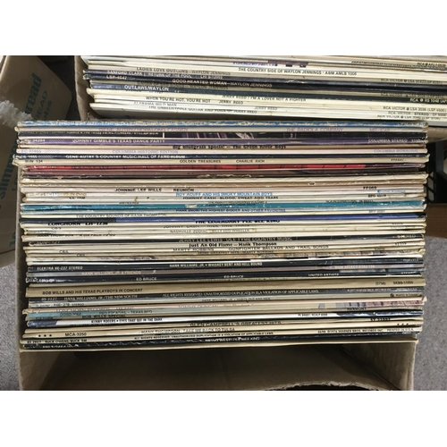 310 - Five boxes of country music LPs and 7inch singles.