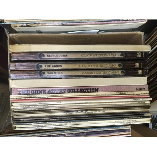 310 - Five boxes of country music LPs and 7inch singles.