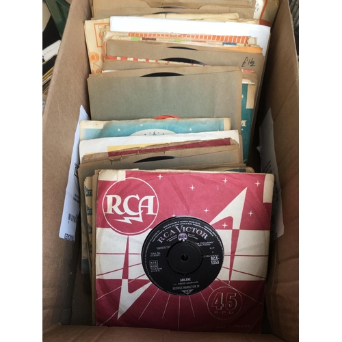 310 - Five boxes of country music LPs and 7inch singles.