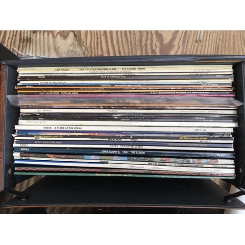 330 - A record case of LPs by various artists including Queen, Kiss, Led Zeppelin and others.