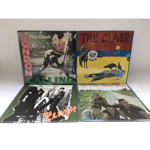 335 - Four LPs by The Clash comprising 'London Calling'Â, 'Combat Rock' and others.