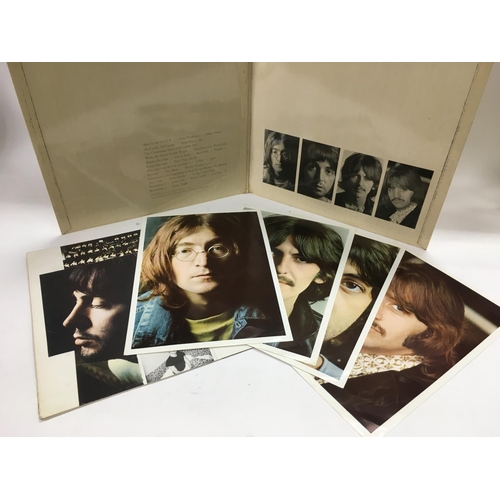 6 - An early numbered Beatles 'White Album', number 0000894, complete with black inner sleeves, poster a... 