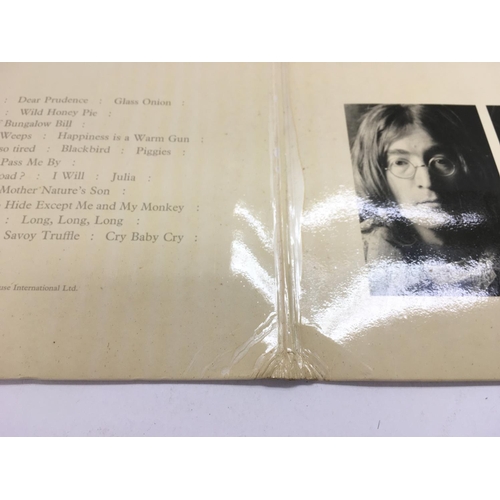 6 - An early numbered Beatles 'White Album', number 0000894, complete with black inner sleeves, poster a... 