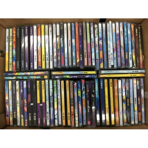 75 - A box of Now compilation CDs.