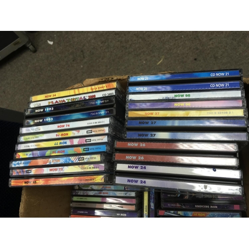 75 - A box of Now compilation CDs.