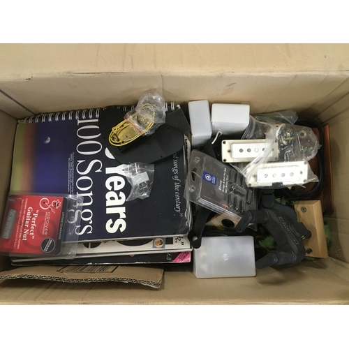 783 - A box of guitar parts and accessories.