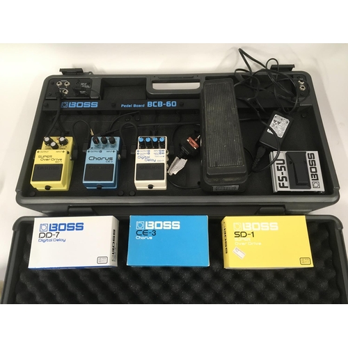 784 - A Boss BCB-60 pedal board plus five pedals comprising a Boss DD-7, Boss CE-3, Boss SD-1, Boss FS-5U ... 