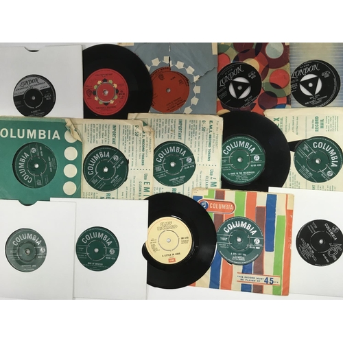 79 - A collection of rock n roll 7inch singles comprising releases by Elvis Presley, Everly Brothers and ... 