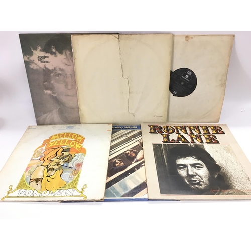 83 - A numbered Beatles 'White Album' 0123840, cover ripped and some scratches to vinyl, no inserts. Also... 