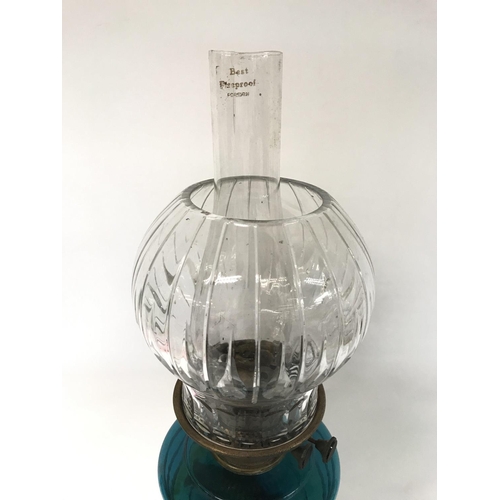 1108 - Victorian oil lamp with unusual base, blue glass reservoire and heavy cut glass shade