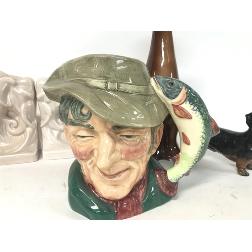 1133 - Pair of pottery elephant book ends, a Beswick pigeon, a Doulton character jug- The Poacher and dog o... 