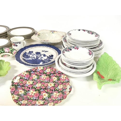 1151 - A collection of assorted plates and dishes including Wedgwood and w Royal Doulton etc.