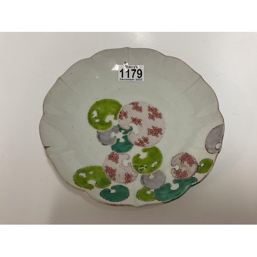 1179 - A Japanese porcelain dish with 4 Character hand painted mark to underside. 22cm diameter.