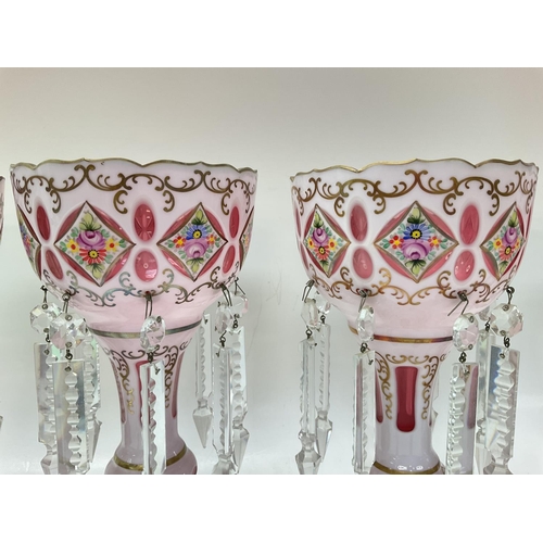 1188 - Victorian Lustres with floral designs, some missing & damaged crystals. Approximately 25cm tall