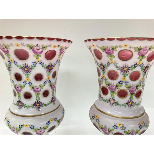 1191 - Late Victorian flower vases with an opaque overlay and painting gilt decoration