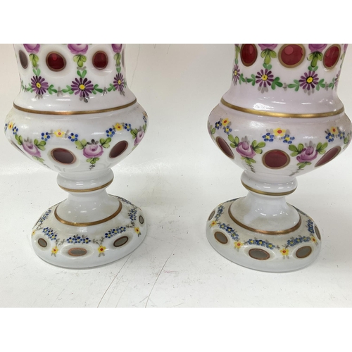 1191 - Late Victorian flower vases with an opaque overlay and painting gilt decoration