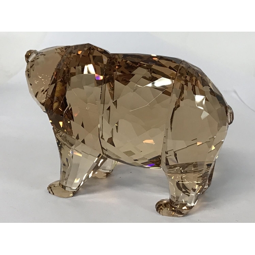 1200 - Three boxed Swarovski pieces including Arcadia Brown bear, Orca and Rose Blossom