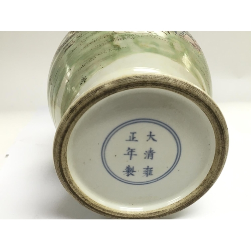 1247 - A Famille rose vase depicting two figures beneath a tree, approx height 33cm.