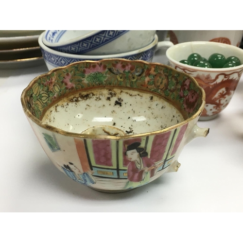 1255 - A collection of Oriental cups, saucers and dishes.