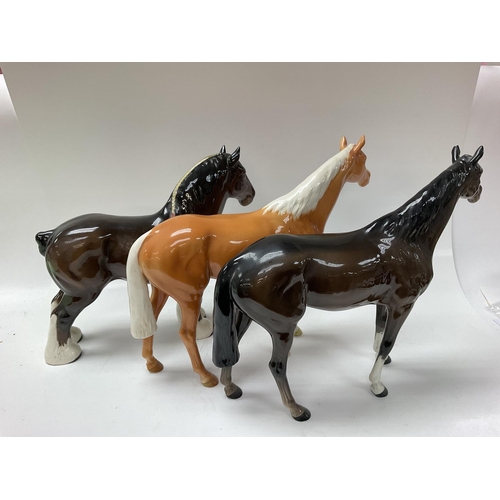 1261 - Three Beswick horse, 26cm high