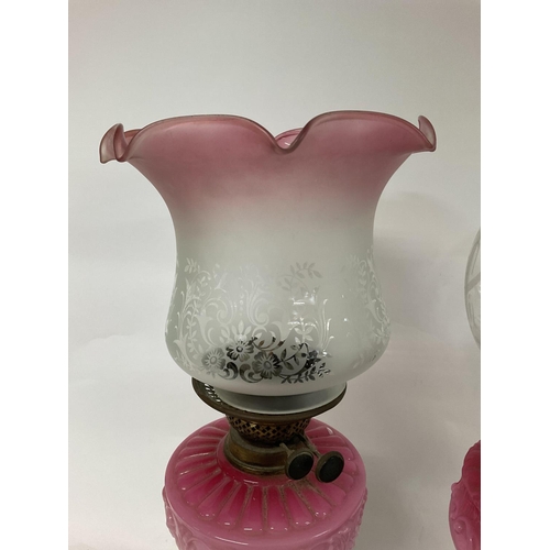 1269 - Oil lamps with cranberry tinted shades