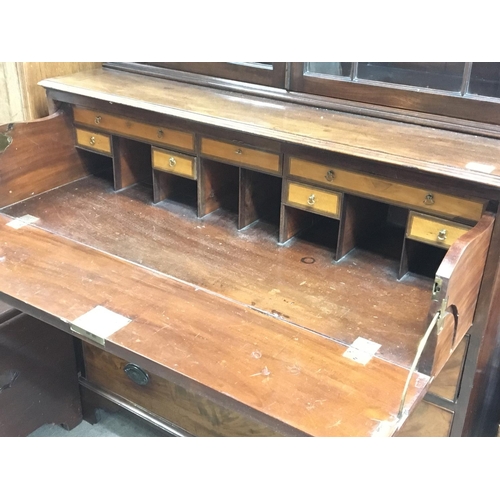 1392 - A Quality George III Mahogany Secretaire bookcase the dentil moulded cornice above glazed doors abov... 