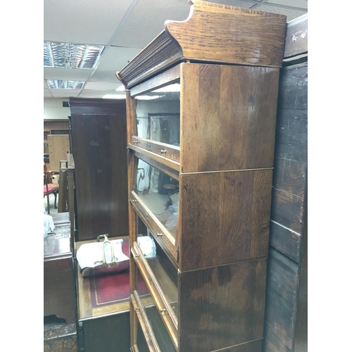 1447 - A globe Wernicke bookcase with 6 tiers. 222cm high 88cm wide 31cm deep.