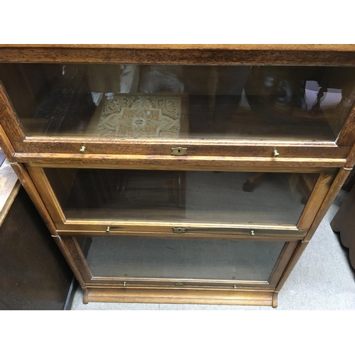 1447 - A globe Wernicke bookcase with 6 tiers. 222cm high 88cm wide 31cm deep.