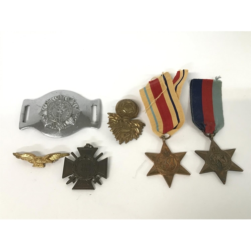 1602 - Two World War II medals together with military issue buckles and badges