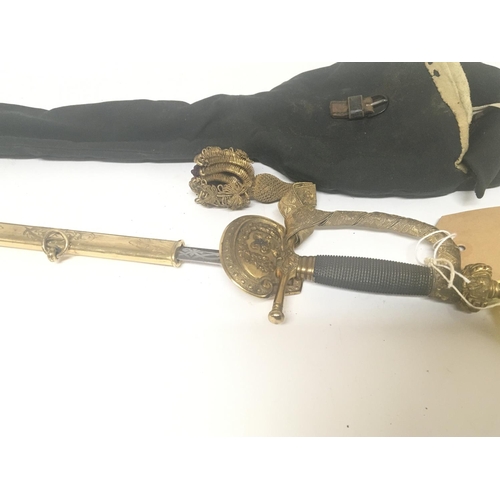 1614 - An elaborate gilt metal Victorian officers dress sword with a crown pommel wired grip engraved blade... 