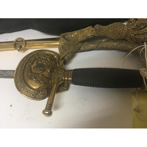 1614 - An elaborate gilt metal Victorian officers dress sword with a crown pommel wired grip engraved blade... 