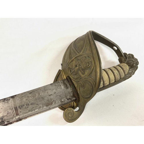 1641 - 1827 Naval pipe backed sword decorated with crown and anchor imagery, approximately 95cm long. A sta... 