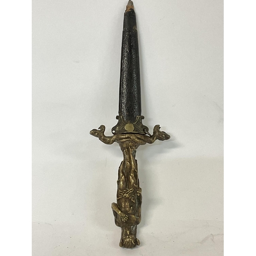 1644 - Romantic/Ritual dagger and scabbard brass grip in the shape of the horned Devil, holding a dagger on... 