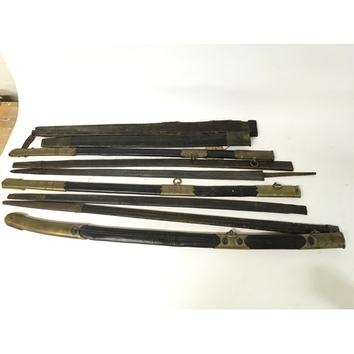 1653 - Various sword scabbards and an old sword blade