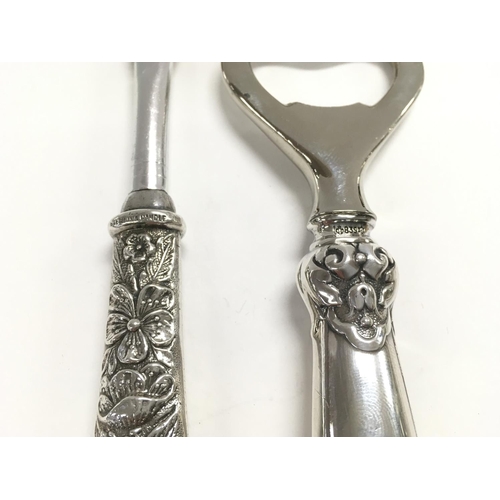 802 - Four silver handled items including razor - brushes and bottle opener.