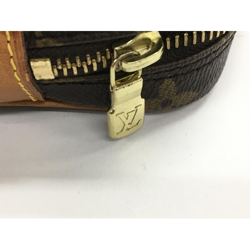 803 - A Louis Vuitton monogram clutch bag. Overall good condition with a few area of wear including inside... 