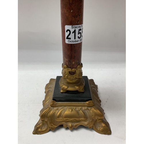 816 - A Victorian Brennan Oil lamp with polished stone central column. 43cm.