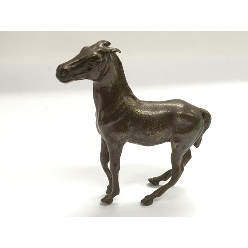 822 - A bronze figure of a horse, approx height 11cm.