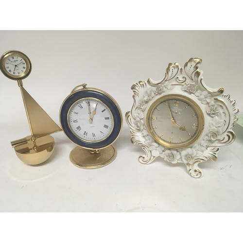 823 - A Coalport porcelain clock and two other modern design clock (3) NO RESERVE