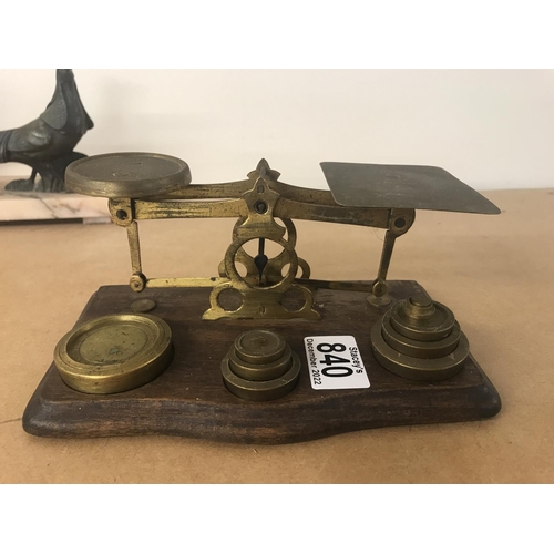 840 - A brass collection of scales and smoker set. Smoker set including tray, candle snuffer, match box ca... 