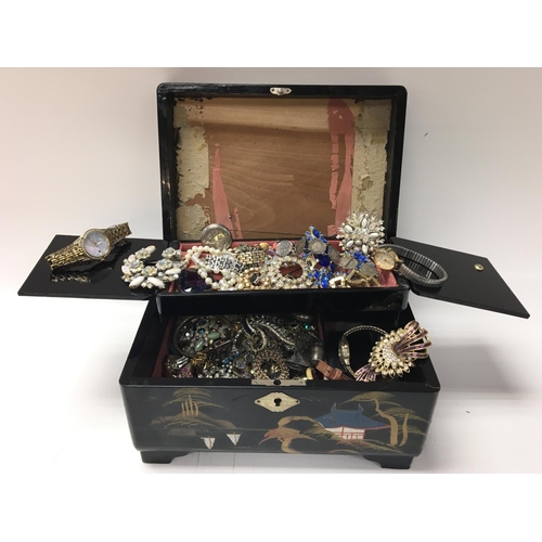 844 - A box containing costume jewellery watches and other oddments