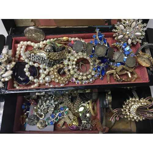 844 - A box containing costume jewellery watches and other oddments