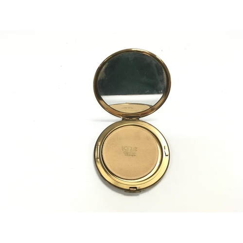 846 - A vogue compact mirror. Approximately 4inch circumference.