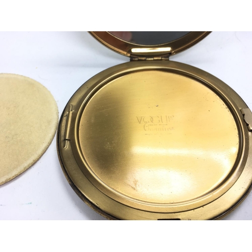 846 - A vogue compact mirror. Approximately 4inch circumference.