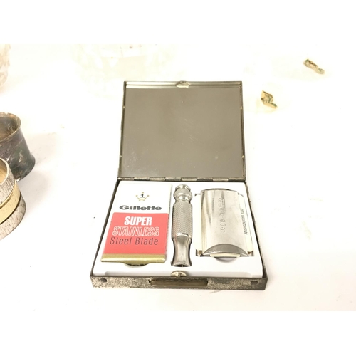 854 - Lot including cut glass items - napkin rings and an old Gillette razor in travel case.