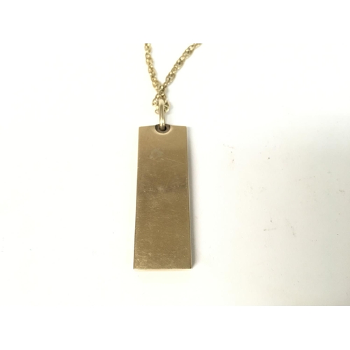 867 - 9ct gold ingot on chain. Total weight 37.56g