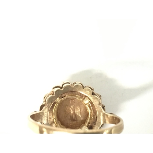 868 - 9ct gold ring set with Emperador coin. Size L and 3g.