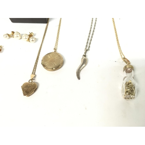 875 - Collection of jewellery including some 9ct items. lockets - dress watch - earrings - ring.