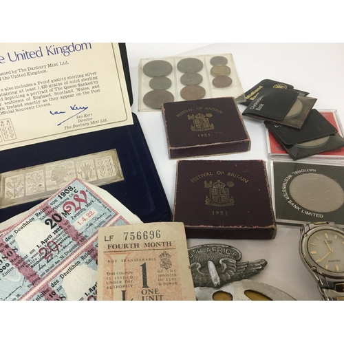 897 - A silver medallion The Queens silver Jubilee Tour a collection of coins bonds and banknotes a silver... 